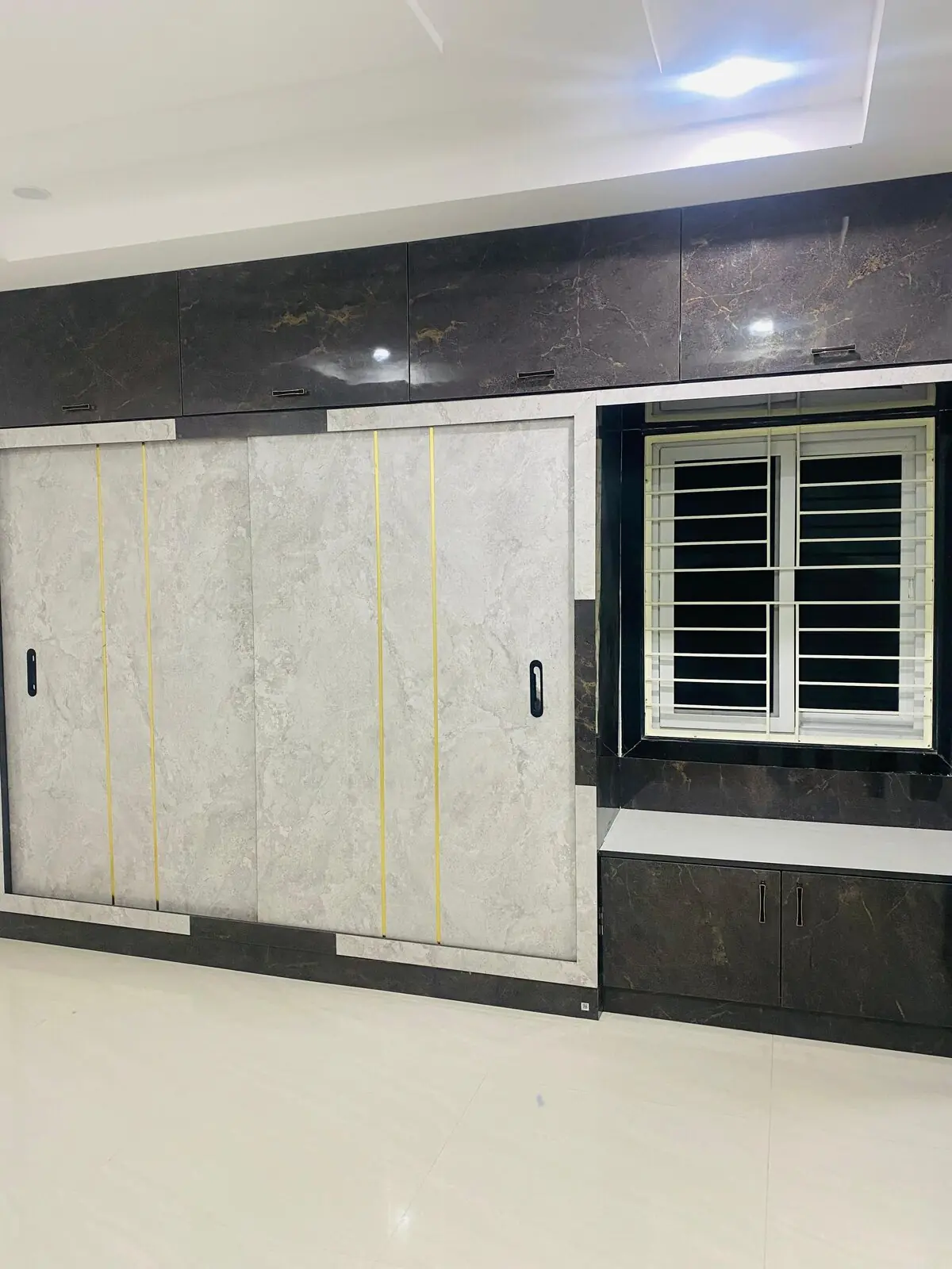 Wardrobe with marble finish & window seat